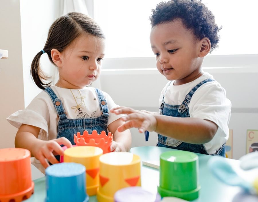 Young children playing and creating together