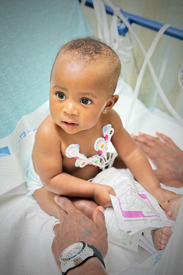 Baby True during a hospital stay, wearing EKG leads